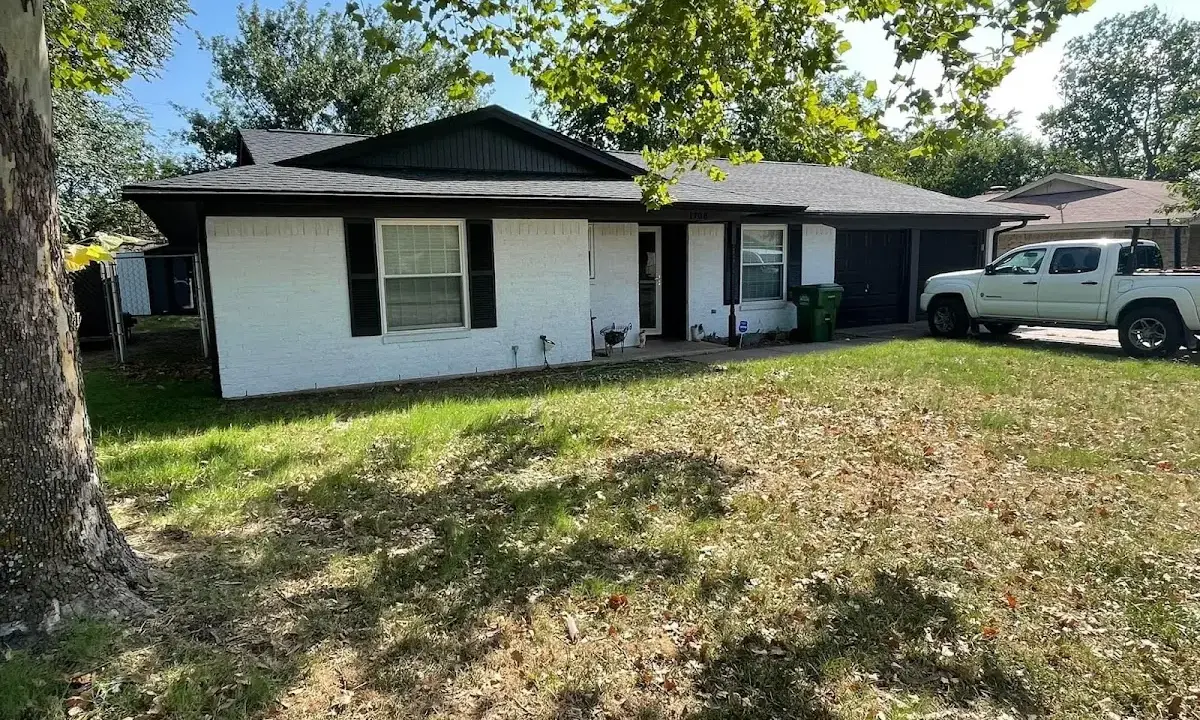 Professional roofing crew working on a residential roof in Monument